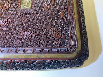 A pair of Chinese black and red cinnabar lacquer square dishes, Qianlong mark and of the period